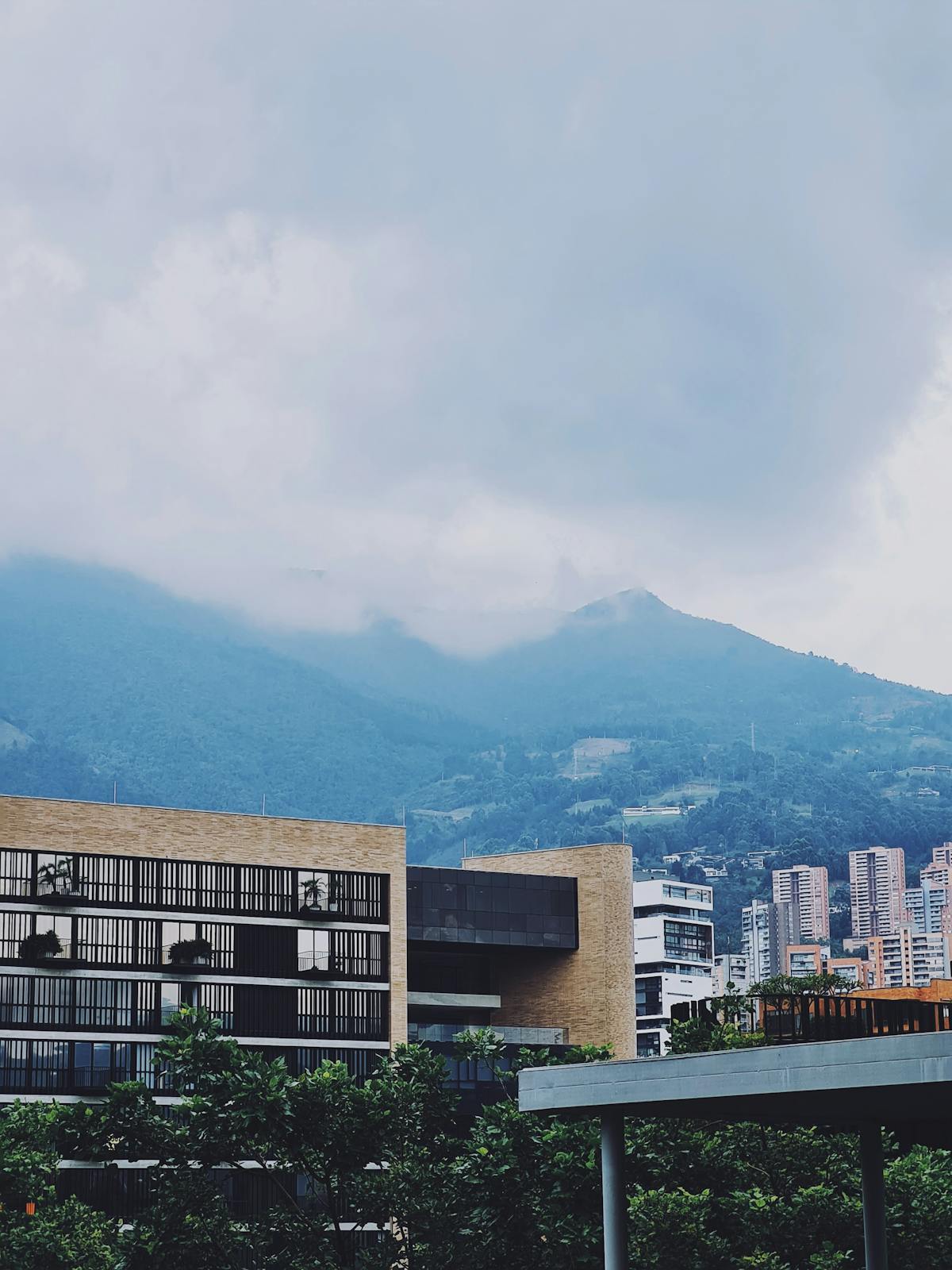 90 days in Colombia - Medellin modern buildings and mountain skyline for American expats
