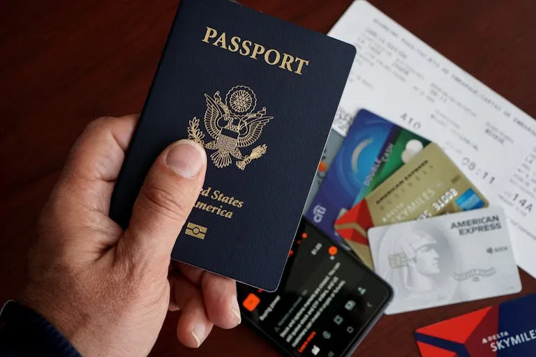 Best Banks for Living Abroad: Top Picks for Expats 14 best banks for living abroad - US passport with credit cards and travel essentials