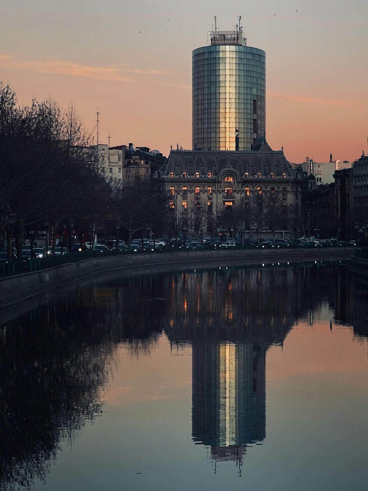 Bucharest cityscape at sunset with building reflection living in Romania as an American