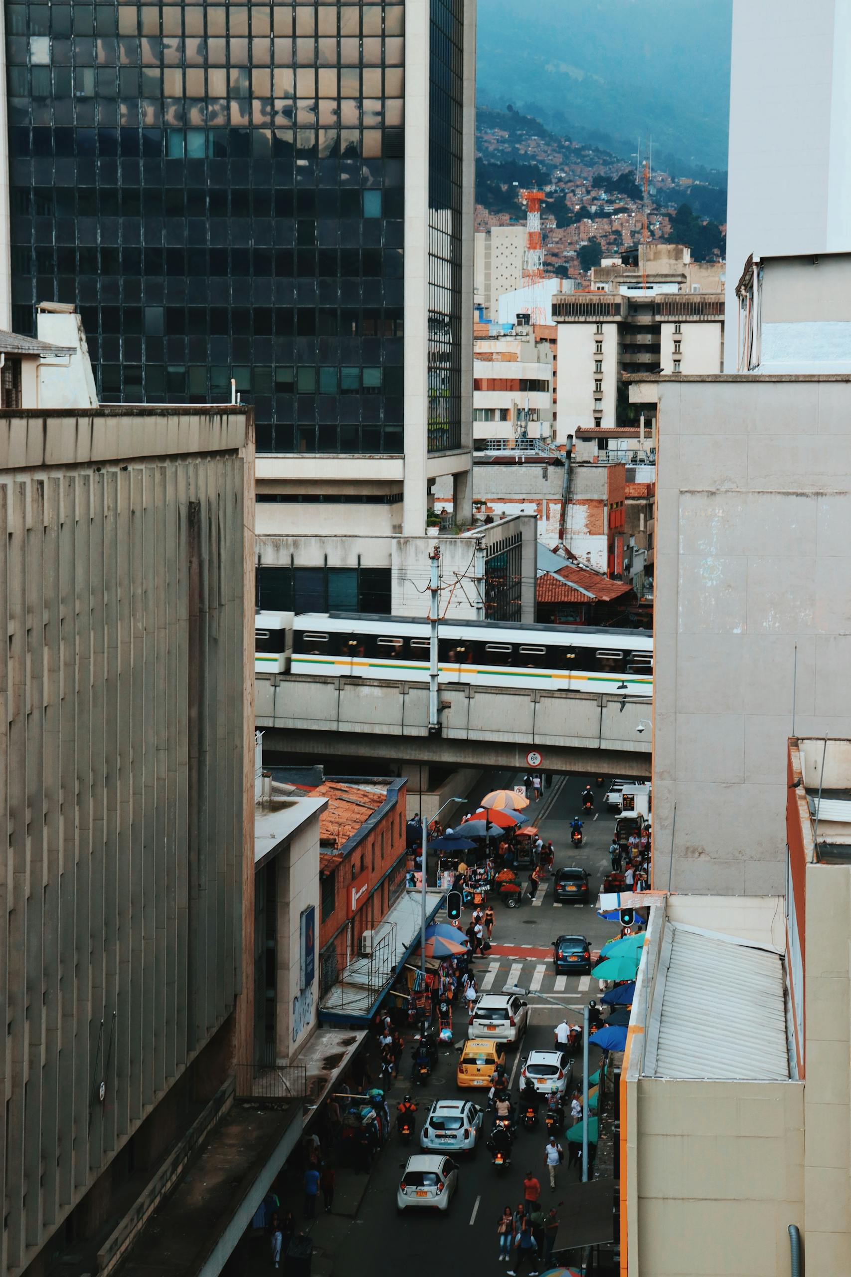 cost of living in medellin for americans - vibrant street scene in downtown Medellin Colombia showing modern skyscrapers