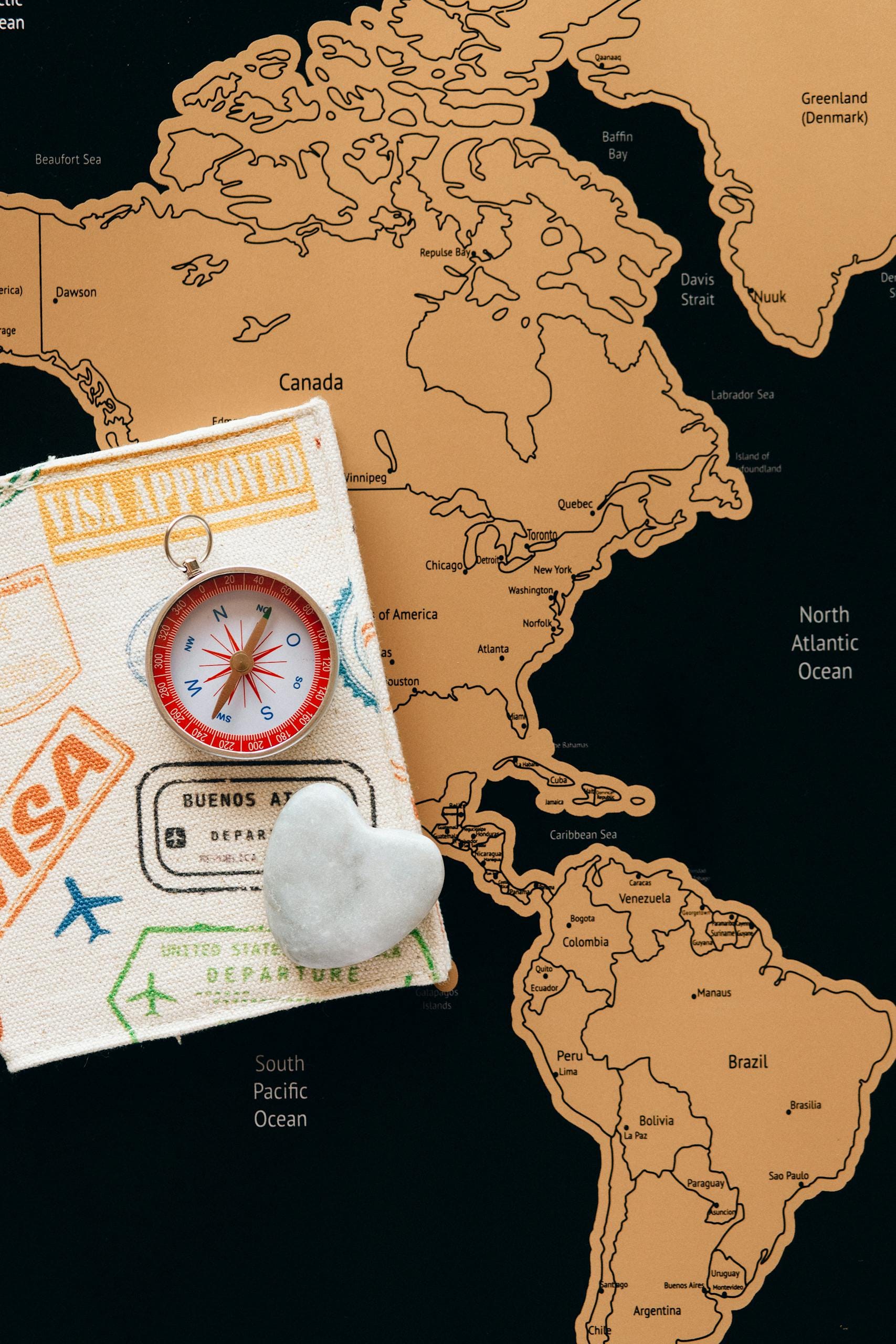 Best countries for Americans to move abroad - world map with passport and compass
