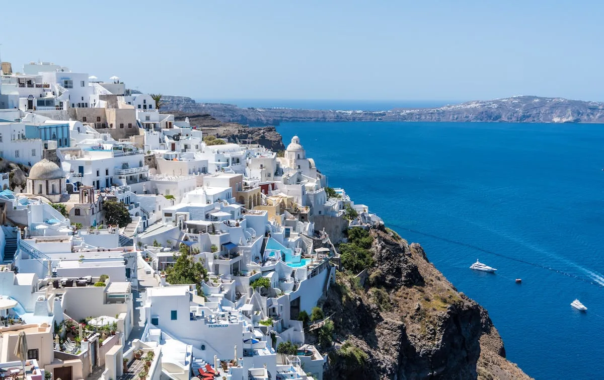 Greek island coastline with clear water showing lifestyle for greece digital nomad visa holders