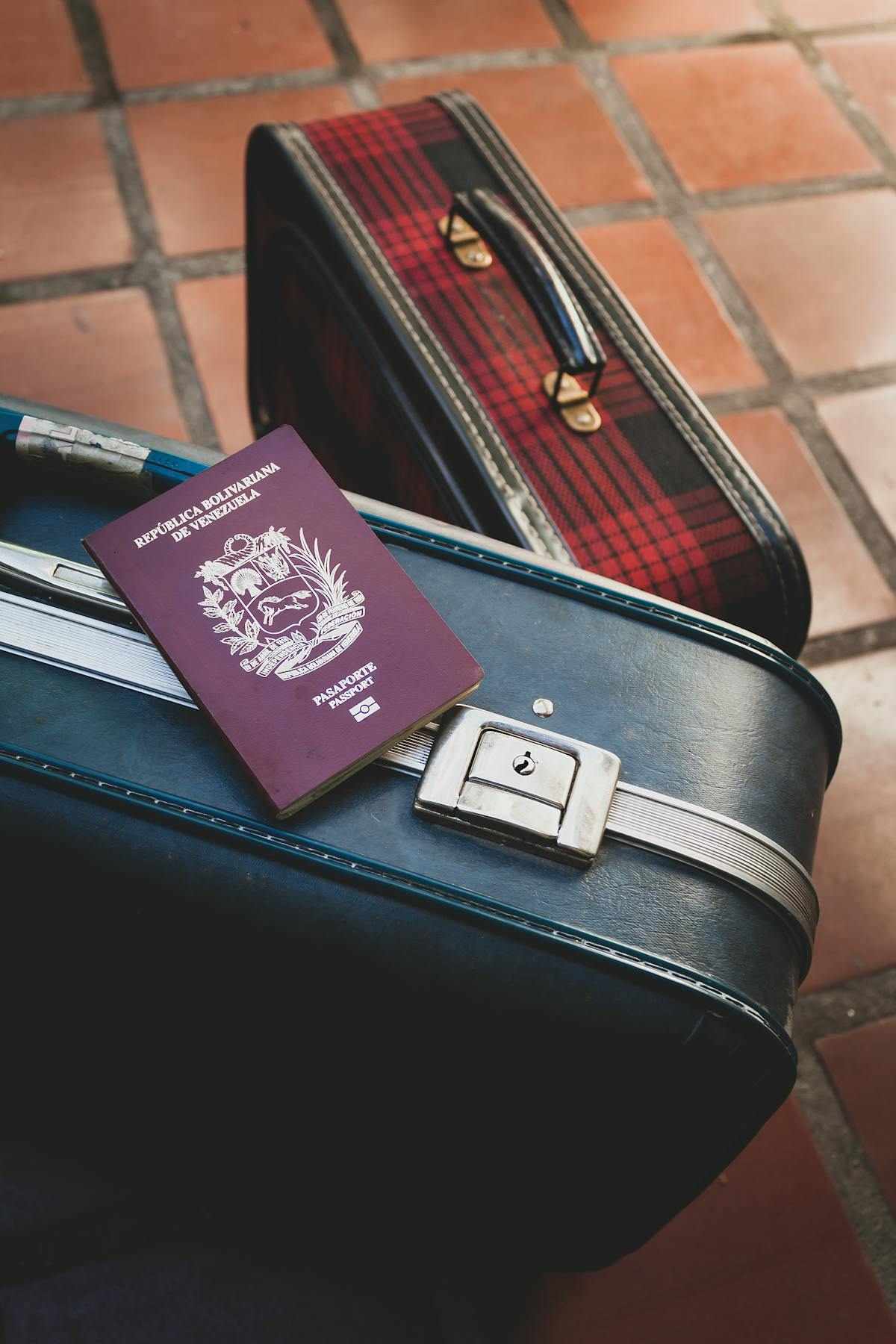 Americans moving abroad statistics - US passport resting on travel suitcase representing the growing trend of Americans moving abroad
