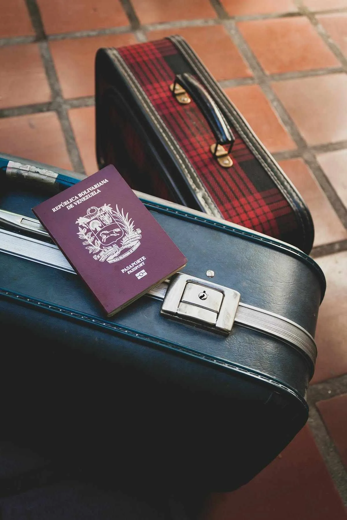 Americans moving abroad statistics - US passport resting on travel suitcase representing the growing trend of Americans moving abroad