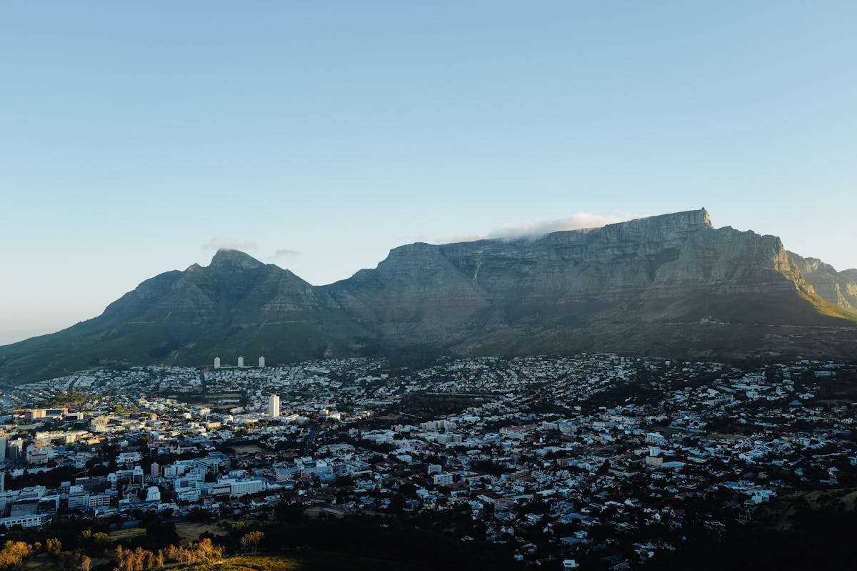 Aerial view of Cape Town neighborhoods with Table Mountain backdrop, South Africa