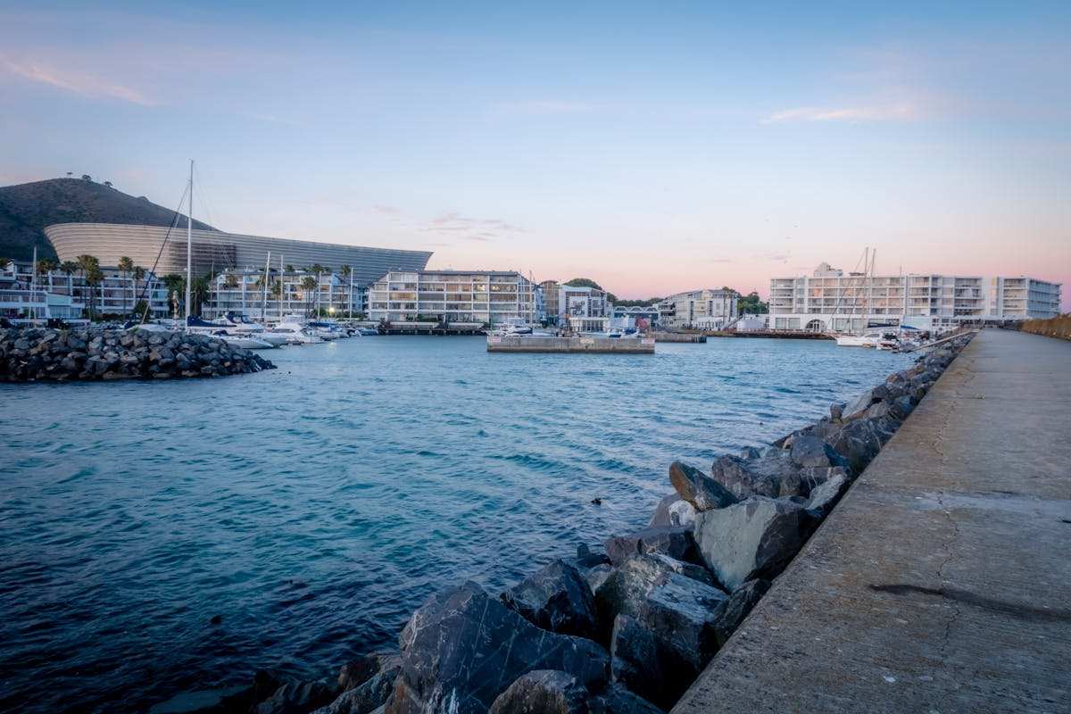Cape Town V&A Waterfront harbor with yachts at sunset, South Africa