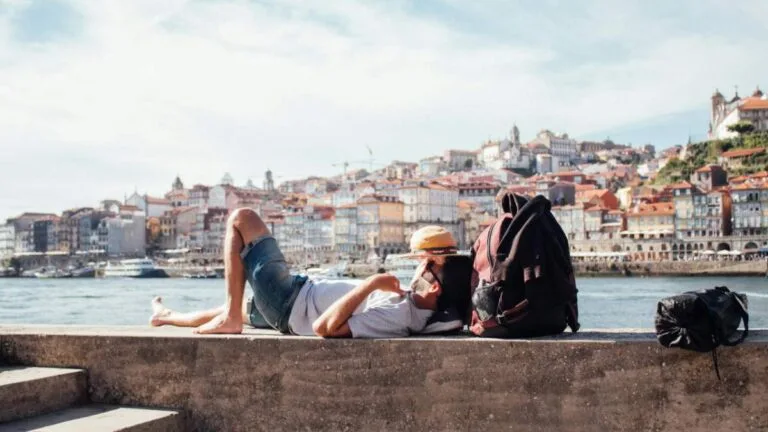 advantages and disadvantages of living abroad - expat enjoying life in a European city