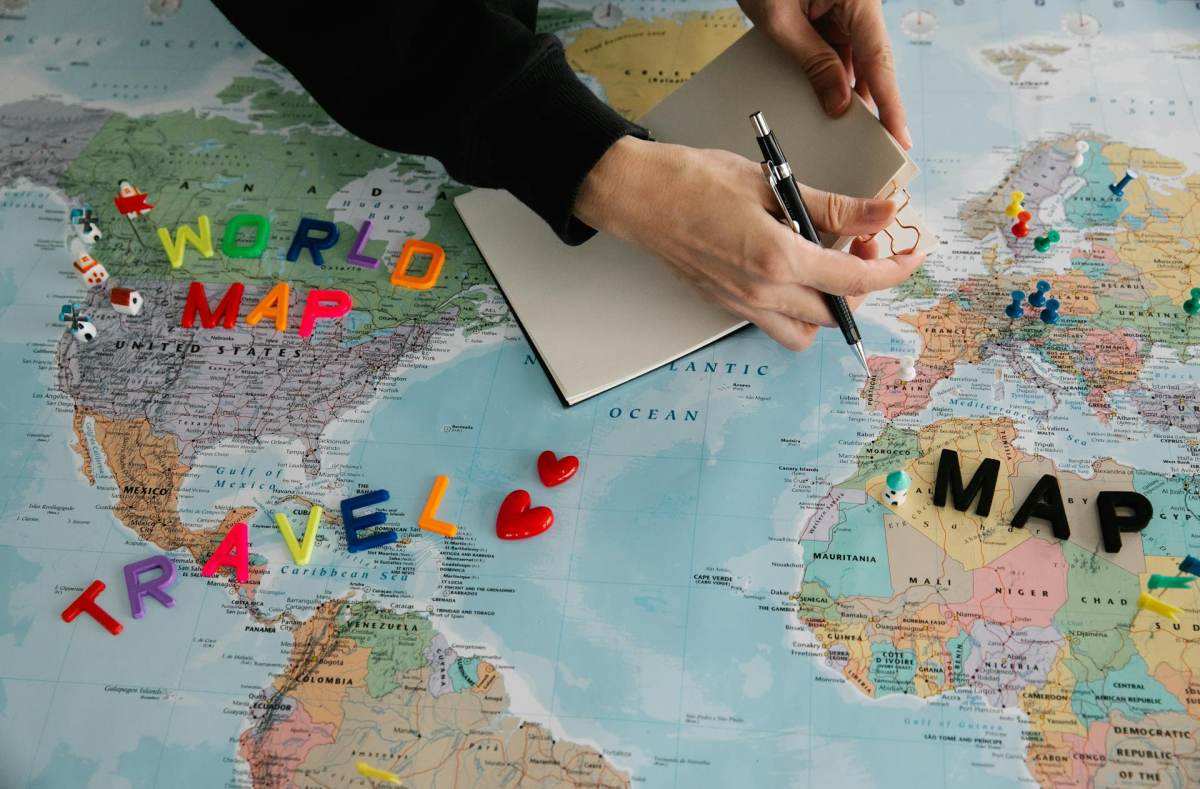 how much money do you need to move abroad - planning destinations on a world map for financial runway calculation
