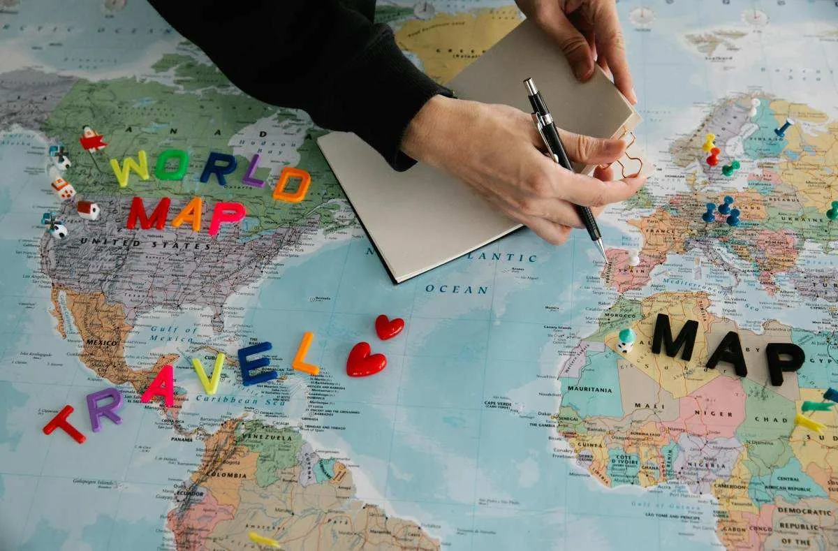 how much money do you need to move abroad - planning destinations on a world map for financial runway calculation
