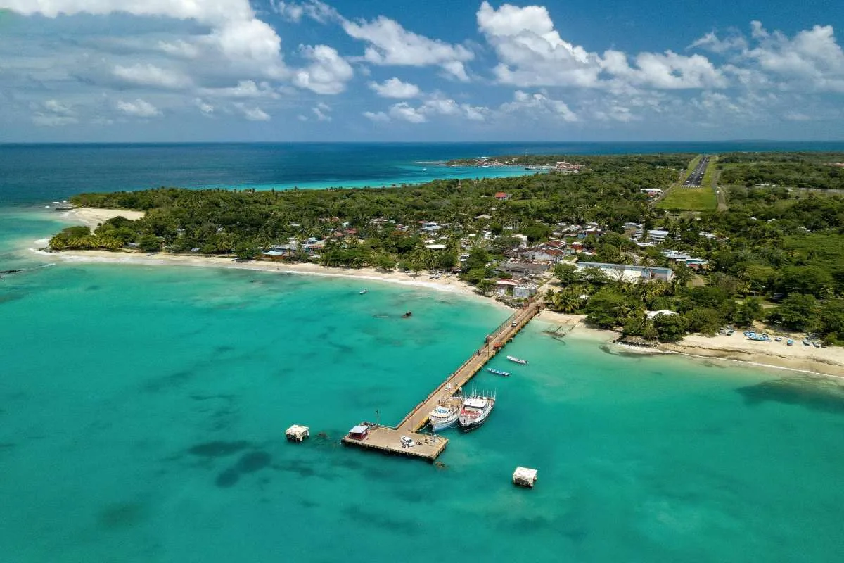 Cost of Living Roatan Honduras for Americans: 7 Real Numbers (2026) 3 cost of living in roatan honduras aerial view dock bay