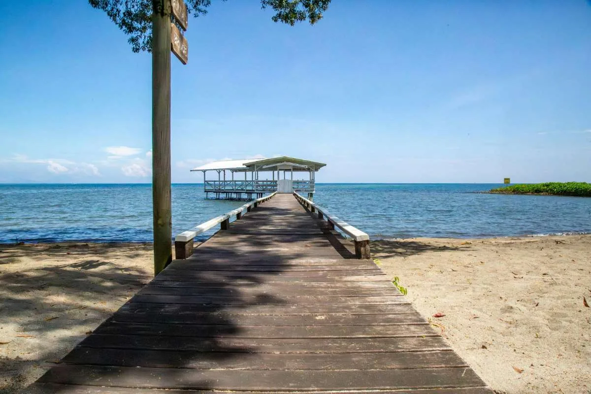 Cost of Living Roatan Honduras for Americans: 7 Real Numbers (2026) 2 cost of living in roatan honduras pier turquoise caribbean water