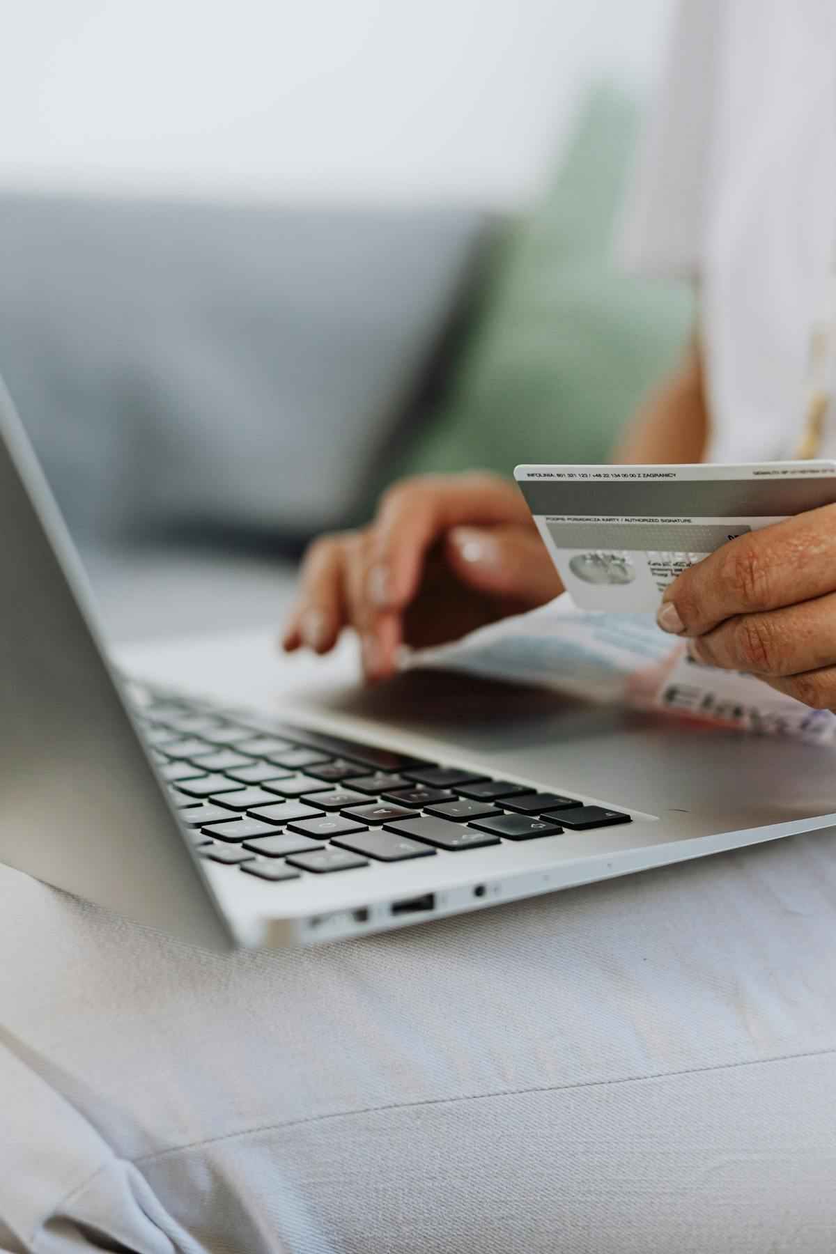 Digital nomad with laptop reviewing SafetyWing nomad insurance options