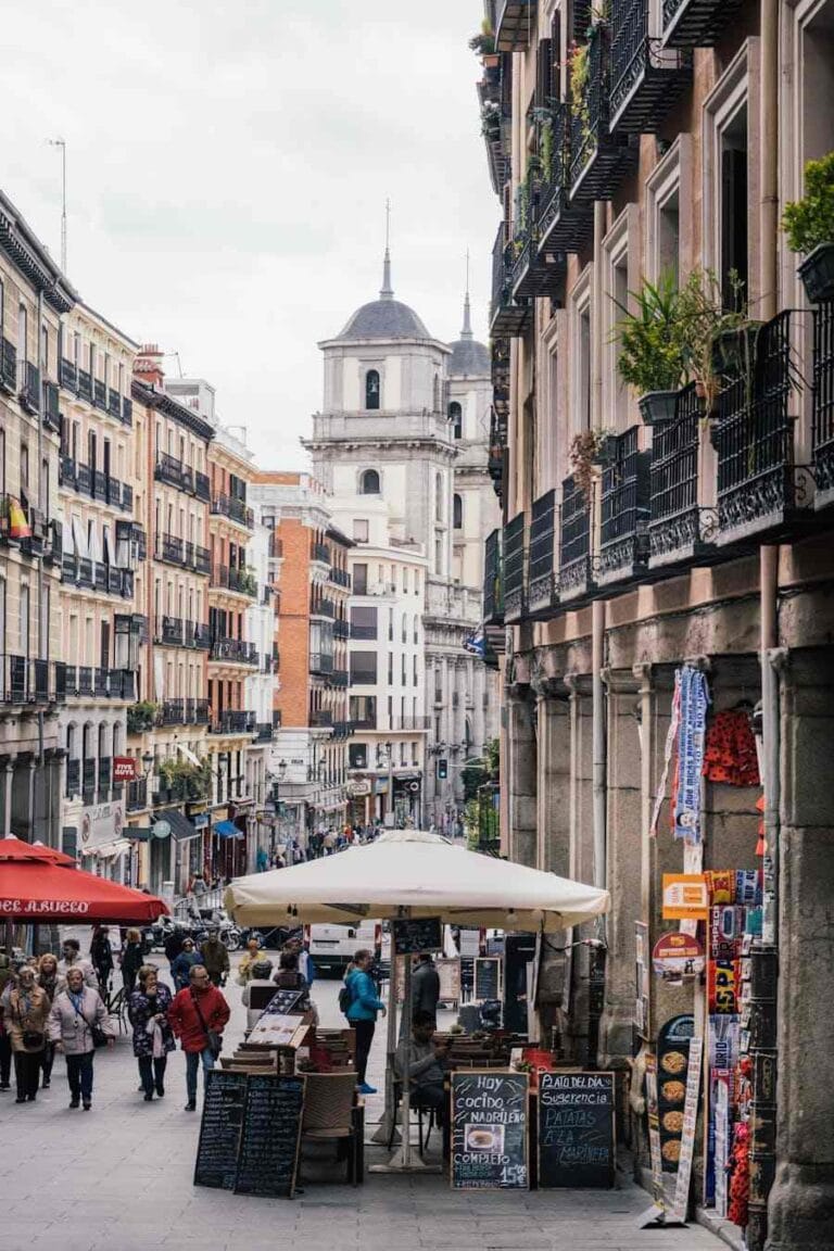 Cost of Living in Spain for Americans: 7 Real Numbers (2026) 6 Busy street market in Madrid showing the cost of living in Spain for Americans in 2026