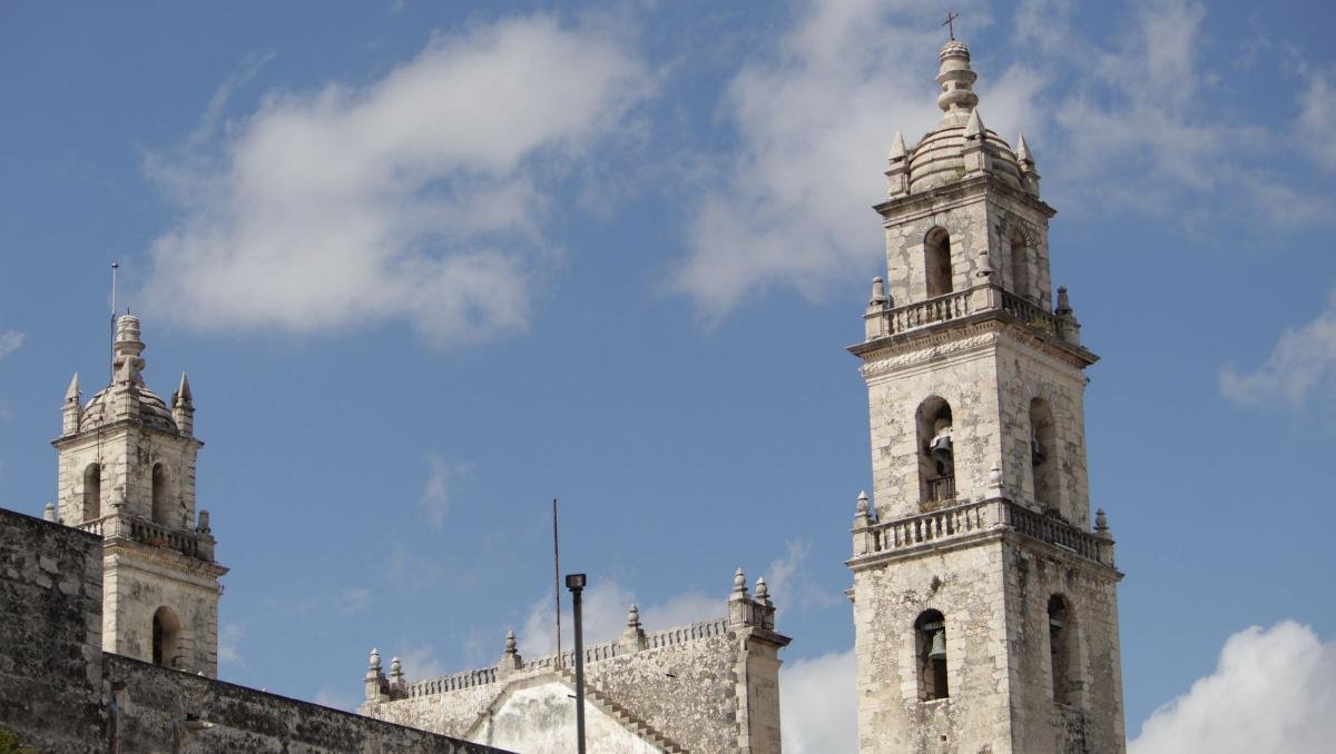 Cheapest Countries to Retire Abroad for Americans (2026) 3 Bell towers of the cathedral in Merida, Yucatan, against a blue sky
