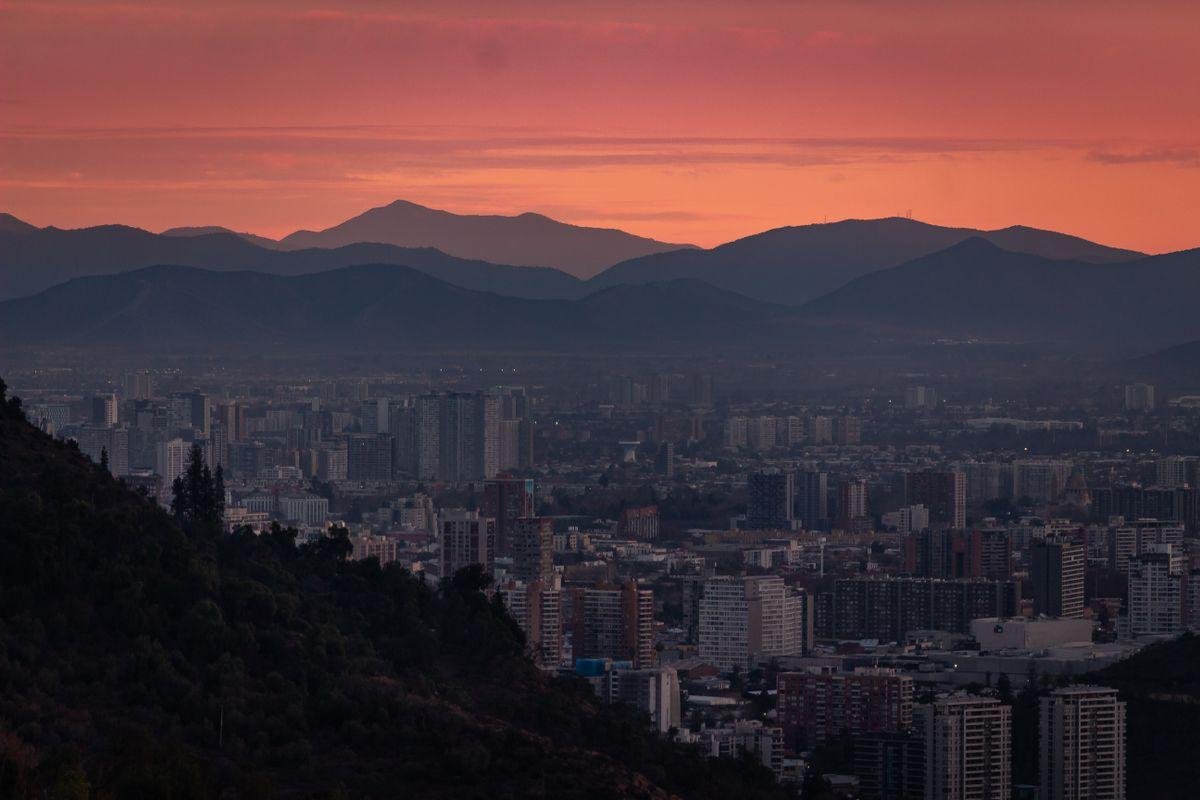 9 Safest Countries in Latin America for Americans (2026) 2 Santiago, Chile, one of the safest countries in Latin America, with the Andes behind the city at sunset